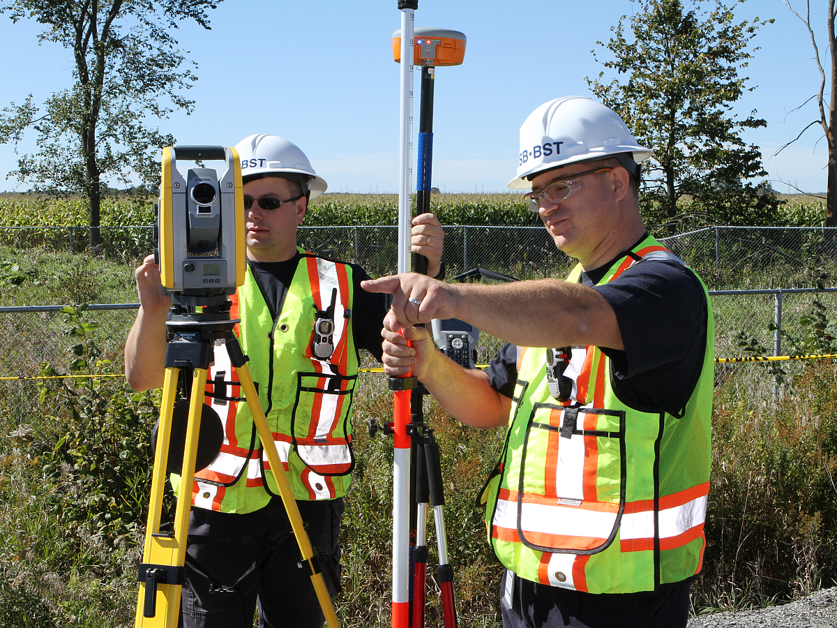 TSB investigators using measuring equipment at the scene of the accident