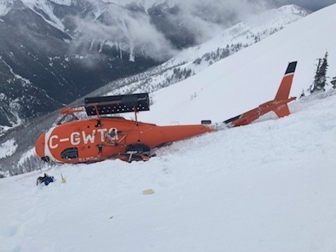The occurrence aircraft, rolled over on its right side (Source: British Columbia Ministry of Transportation and Infrastructure)