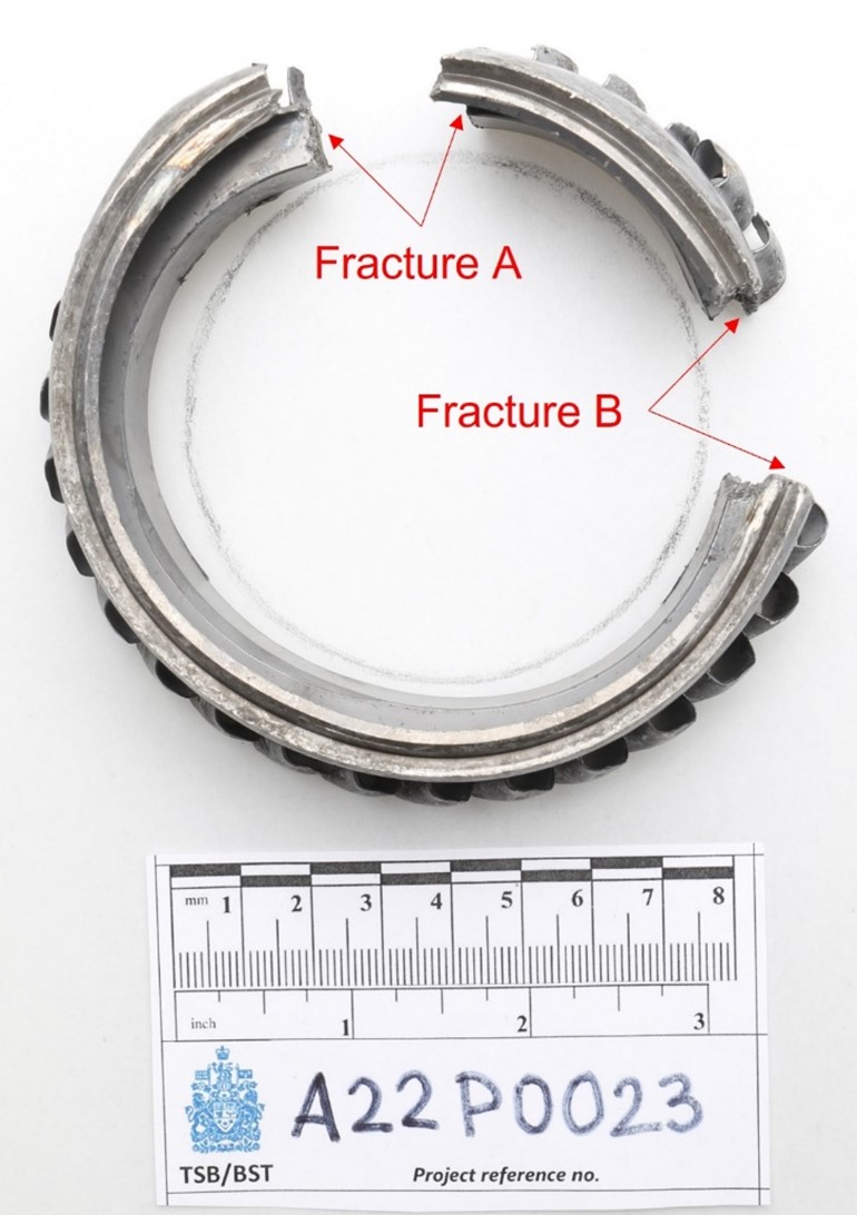Fractured sixth stage compressor wheel. The drawn circle indicates the circumference of the wheel before it was fractured (Source: TSB)