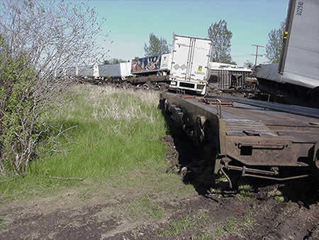 Derailed rolling stock west of crossing with Highway 34, mile 48.3 of the Winchester Subdivision