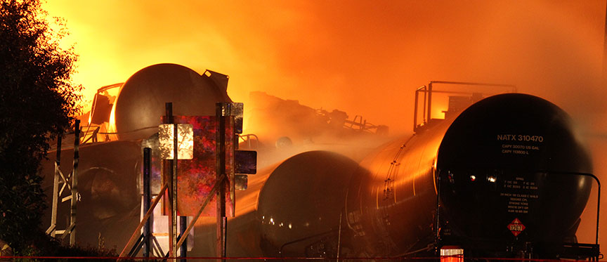 Image of derailed and burning tank cars
