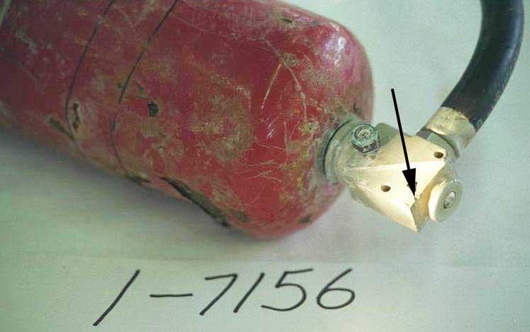 Recovered dry chemical extinguisher - Exhibit 1-7156 - impact marks