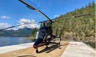 Figure 3. The occurrence helicopter on the fuel barge at Killam Bay (Source: Black Tusk Helicopter Inc.) 