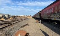 Figure 3. View from the south side of the main track, looking east, showing several pile-ups of derailed cars (Source: Canadian Pacific)