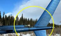 Figure 4. Occurrence helicopter’s tail boom, showing the “DANGER” and arrow markings as well as the approximate radius of the tail rotor arc (Source: Heli Explore Inc., with TSB annotations)