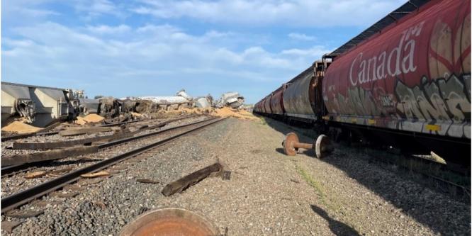 Figure 3. View from the south side of the main track, looking east, showing several pile-ups of derailed cars (Source: Canadian Pacific)