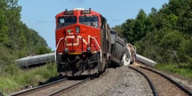 Figure 2. View of tail-end locomotive and derailed cars (Source: Canadian National Railway Company)